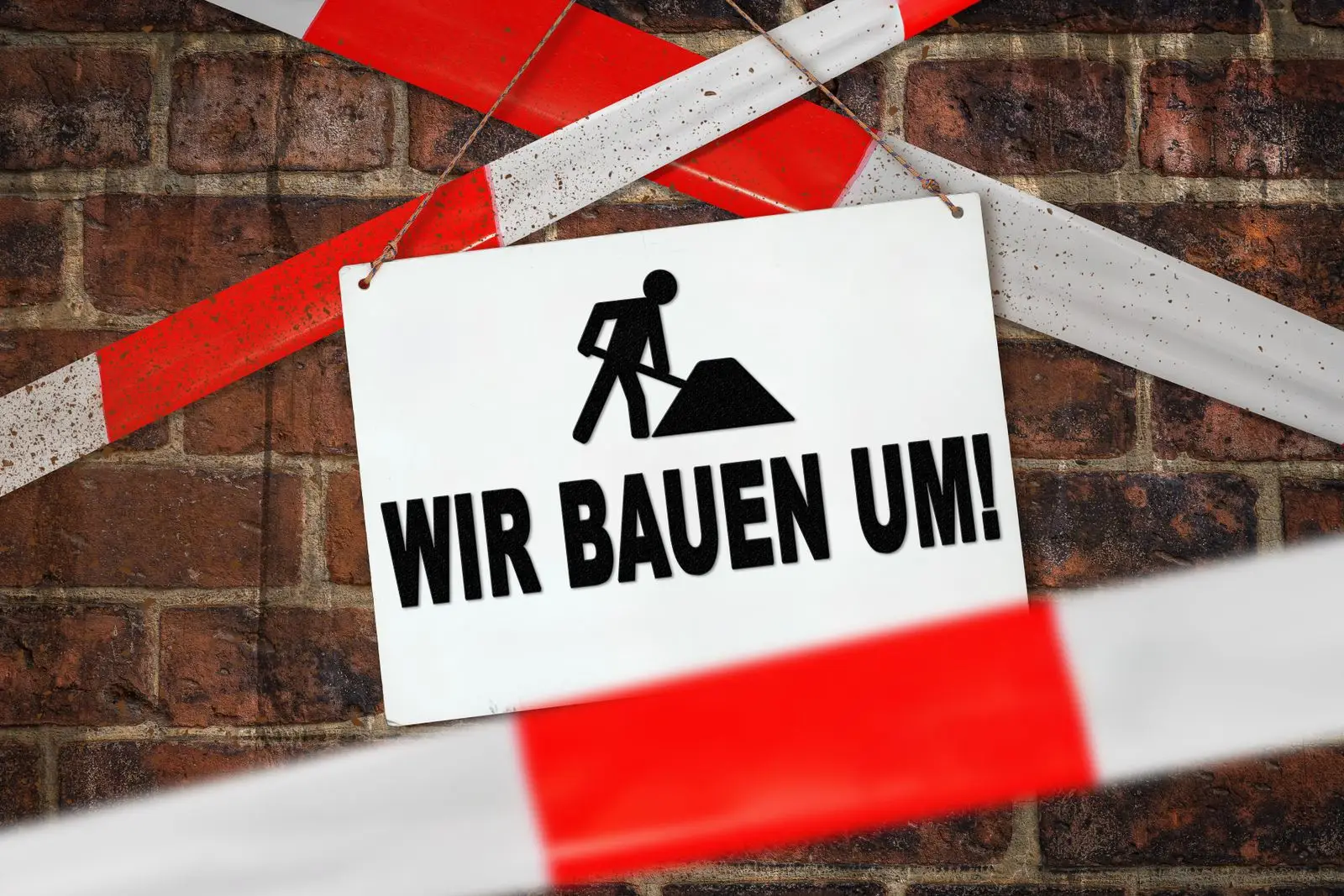Wir bauen um, schild