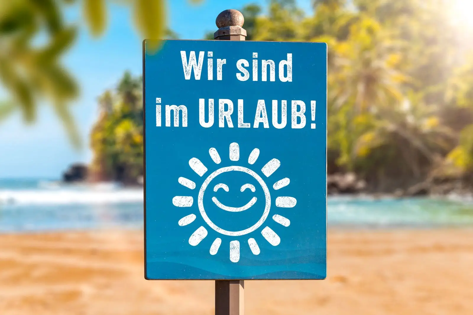 Wir sind im urlaub – schild mit urlaubsgruß aus der karibik
